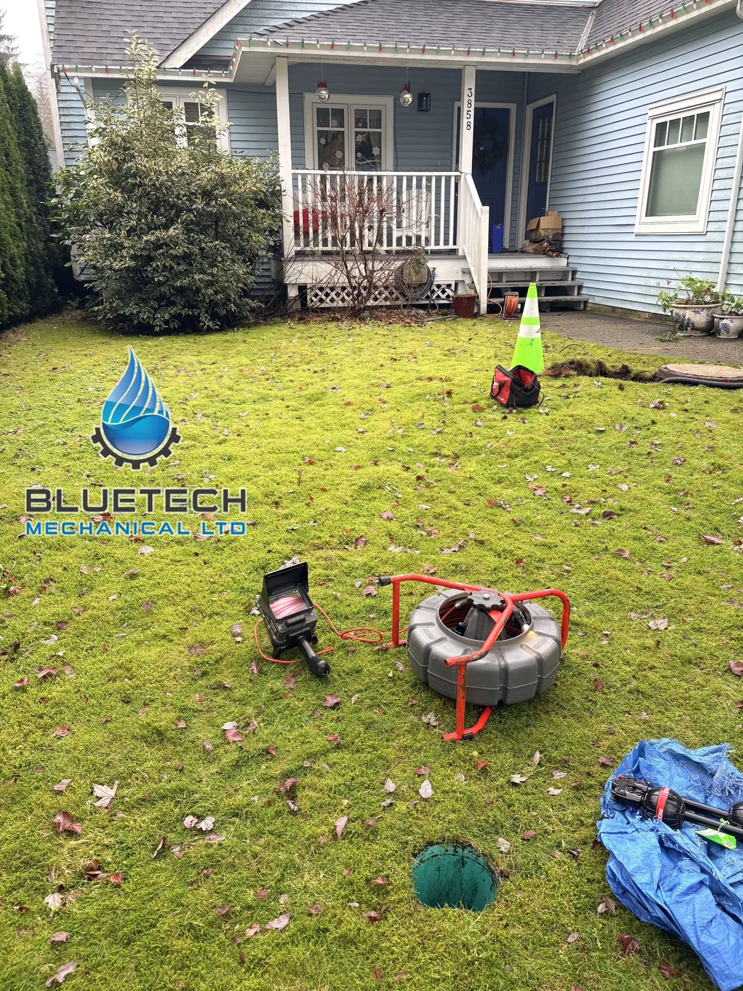 Drain cleaning and sewer camera equipment set up on a job site